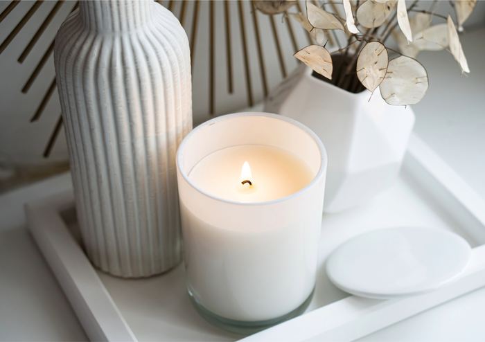 Console table home organising detail with candles, vases and pampas grass