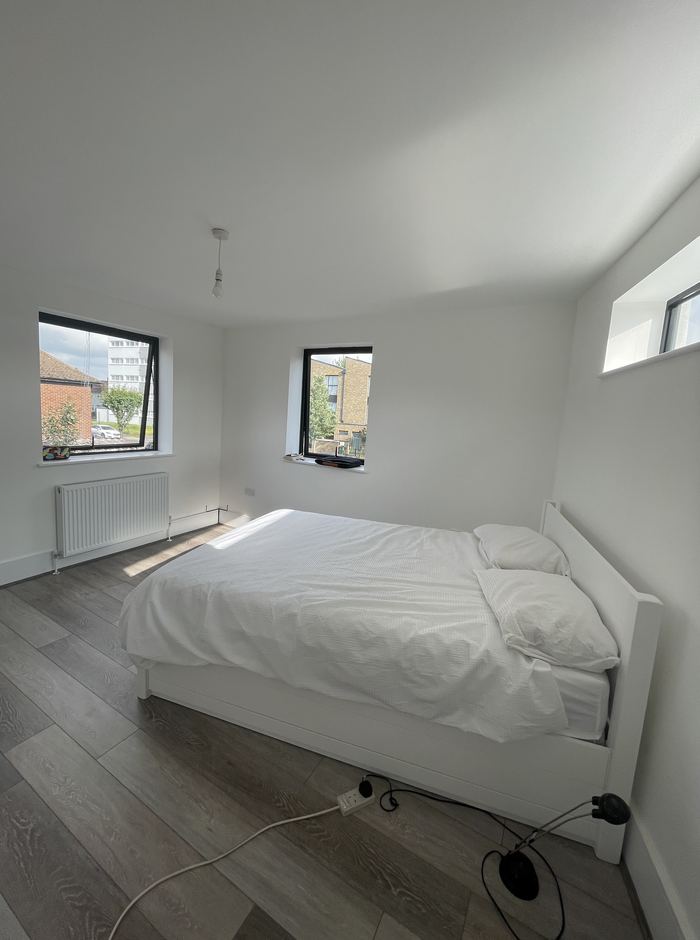 Empty bedroom before home staging, dual windows